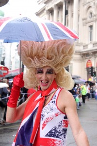 The events of Pride: The London events to celebrate World Pride 2012. A march and public event. Crowds on the streets in costume with banners. LGBT pride event.